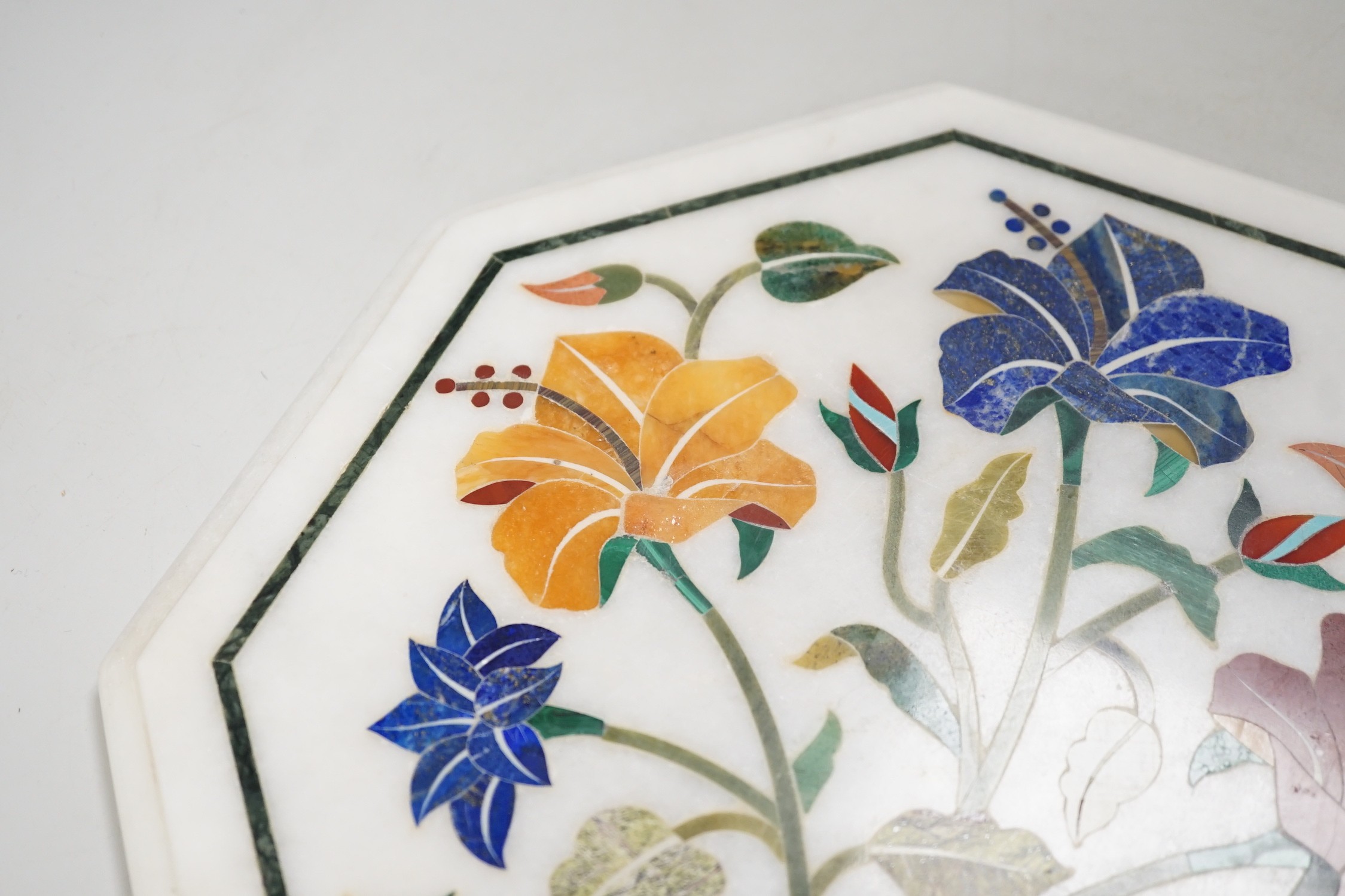 An Agra hardstone inlaid table top. 30cm wide
